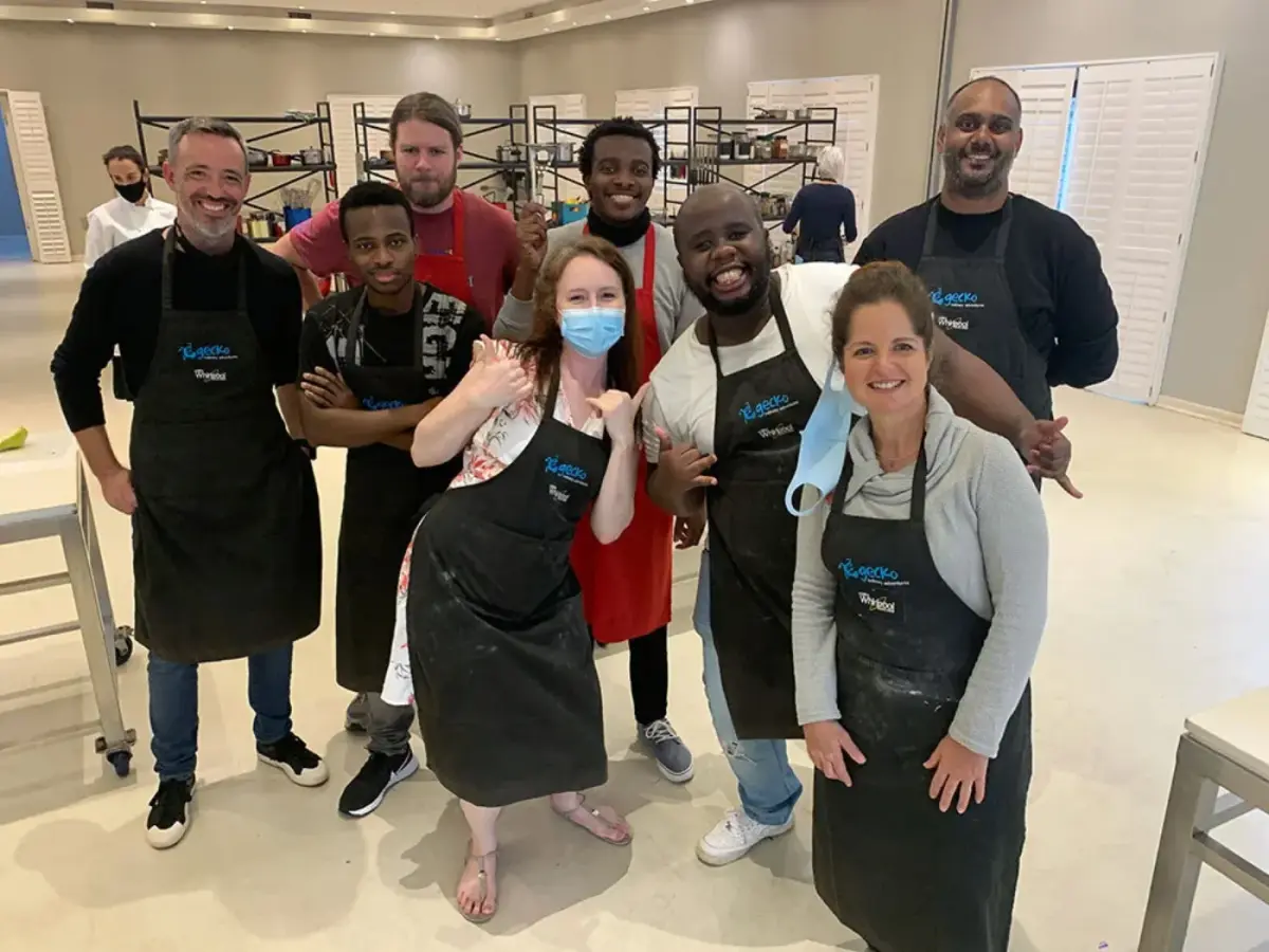 The Codeo team in aprons at a team event